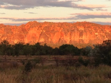 Sun setting on the Bungle Bungles. The light glows with changing oranges, pinks, and lavenders that is other worldly.